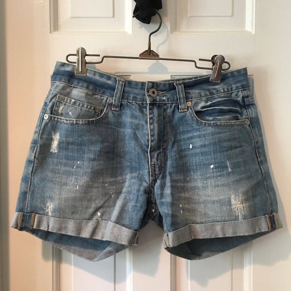 Low rise distressed and paint splattered shorts